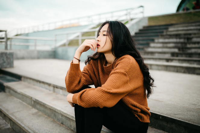 woman-looking-thoughtful-stairs